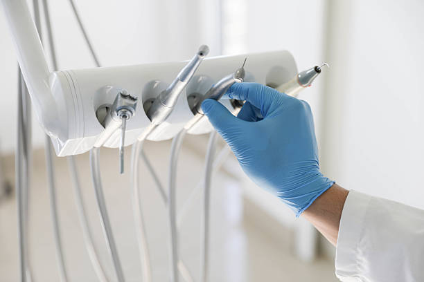 Professional Tooth Extraction technician working in Charleston, MS